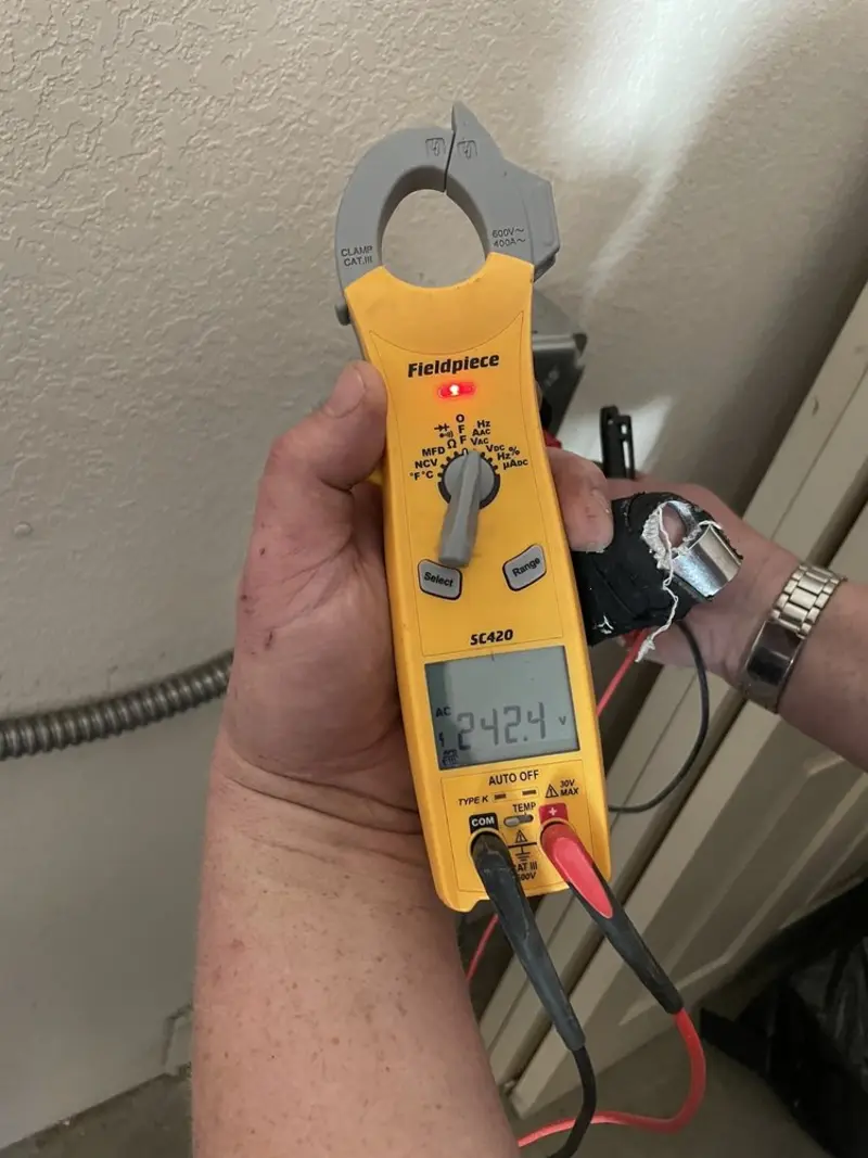 Voltage testing with clamp meter during Electrical Installation Services in Orange Park